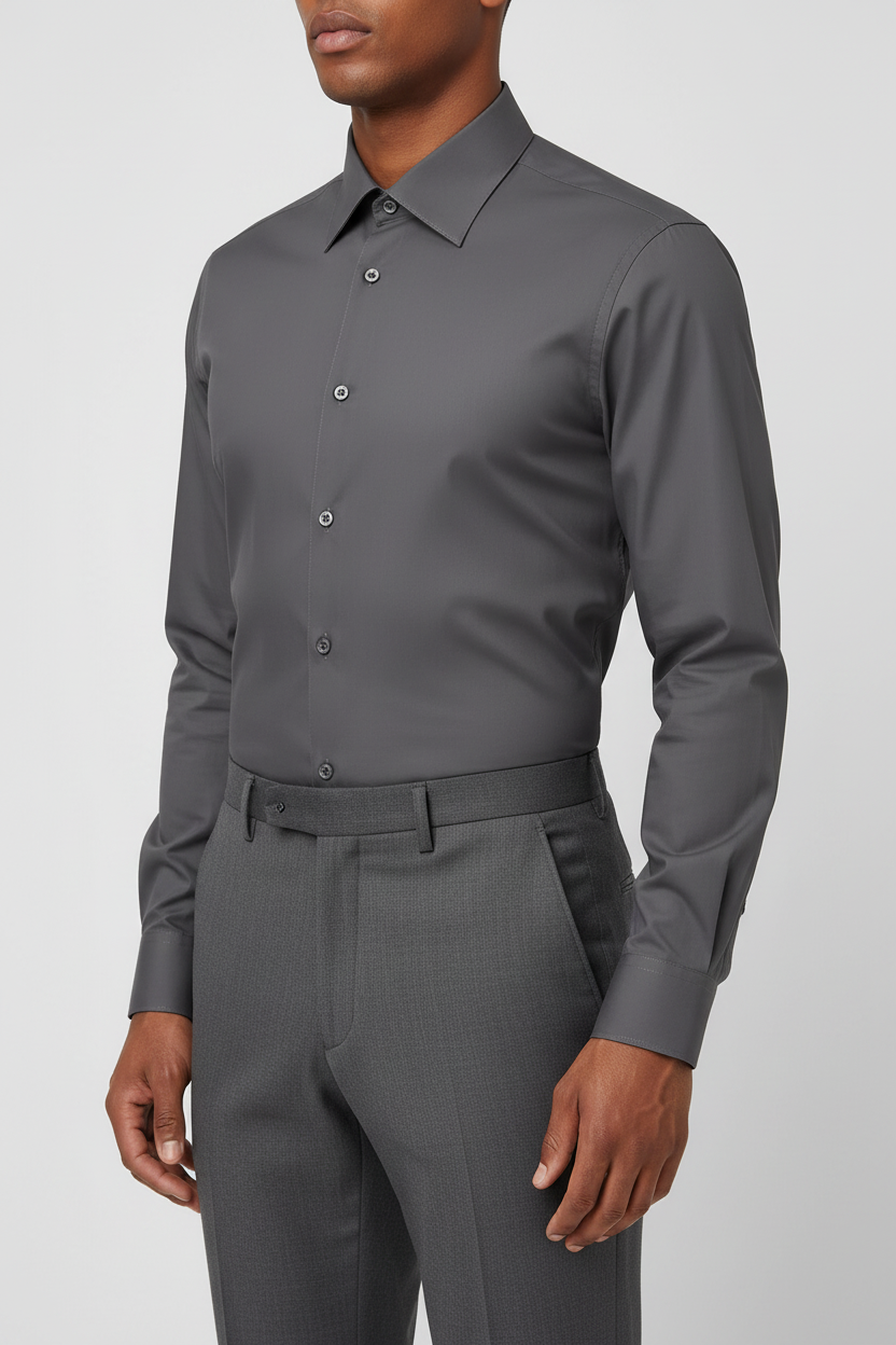 Adult male model wearing the Dark Gray long sleeve dress shirt in a front three-quarter pose
